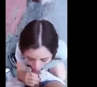 Slutty college chick sucks cock balls deep in alley