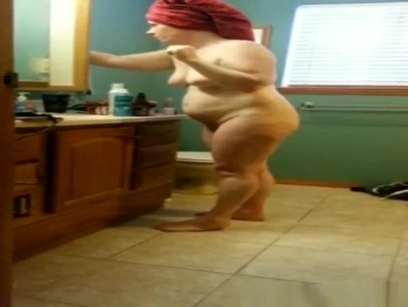 Mature woman with towel in head