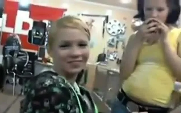Two girls giving blowjob in shop