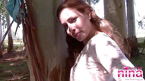 Lesbian Nina get nude showing natural tits and shaved pussy