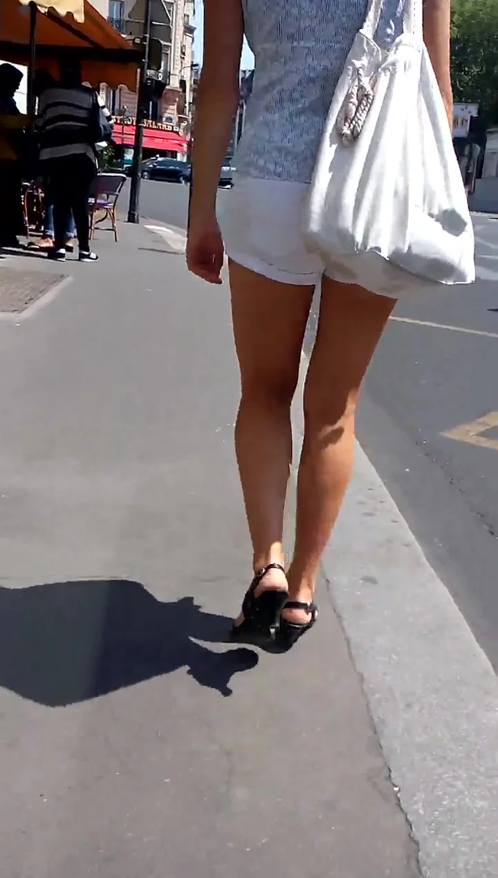 beautifull legs walking in the street in mini shorts