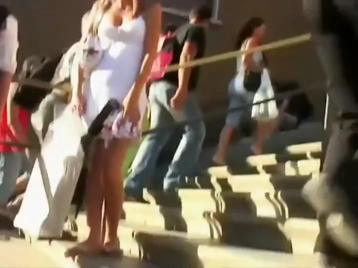 Flawless ass under a college girl's skirt