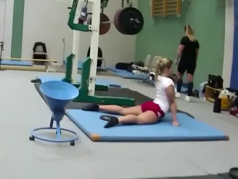 Sexy weightlifter girl during workout
