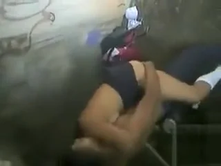 Young lovers enjoy copulating in the dirty public place