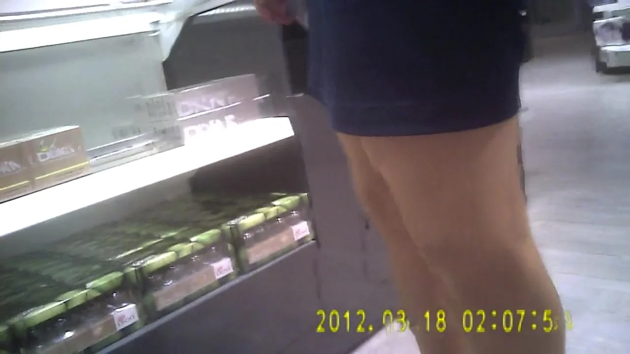 Store girl in shiny tan pantyhose and tight skirt