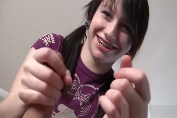 Petite girl with pigtails gives her first hand job