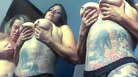 Lesbians slap and suck tits and have hot sex.