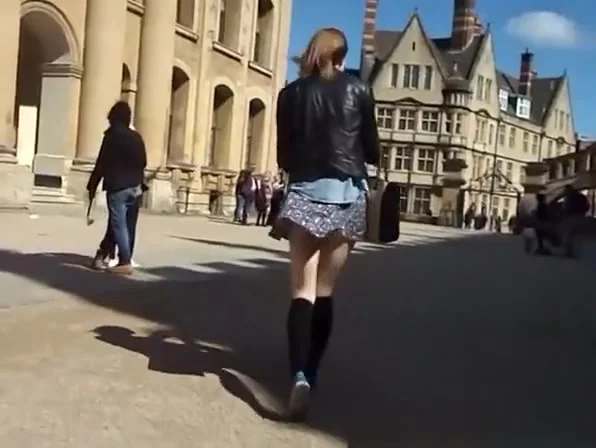 Wind lifts teen 18+ short skirt and exposes her ass