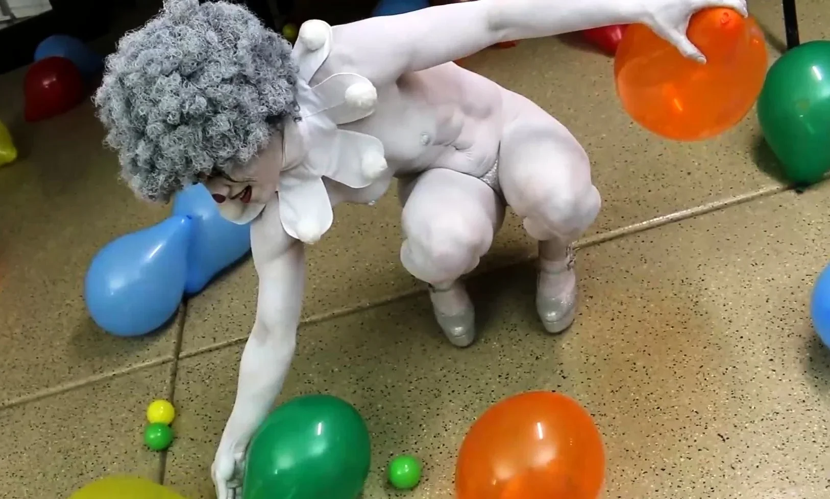 Cosplay video with naked clown babe