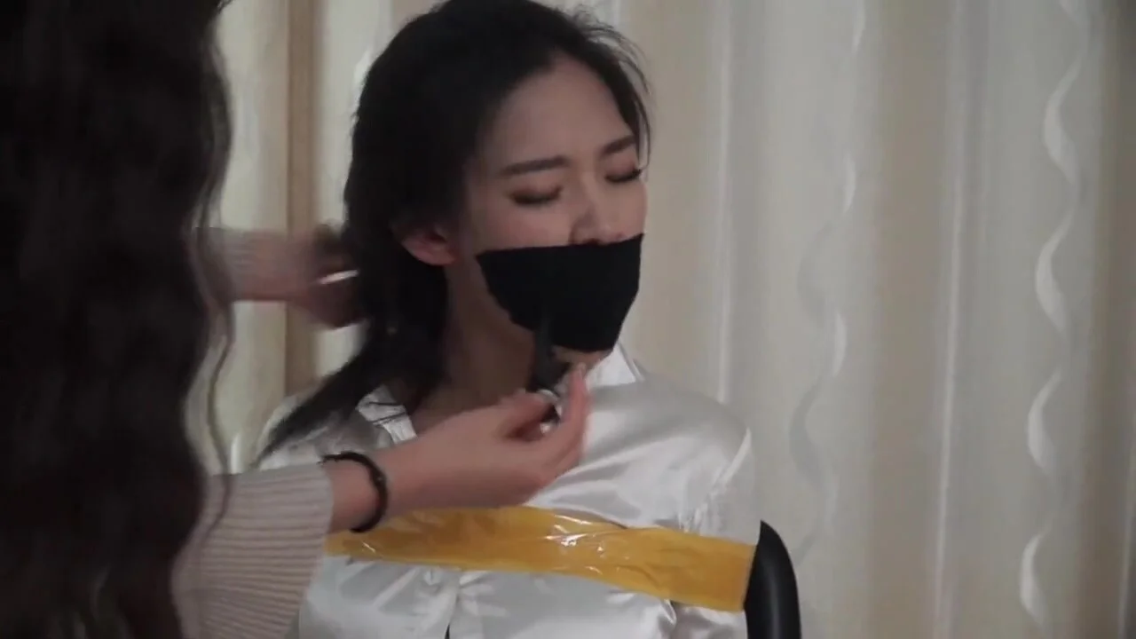 Asian Girl Taped and Stuffed