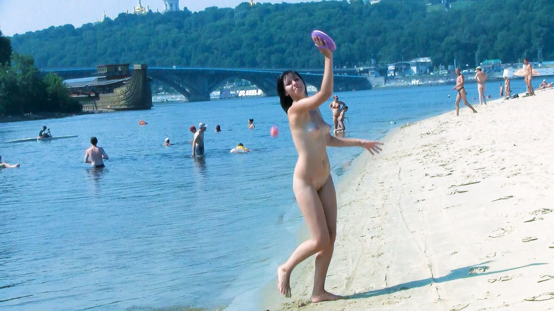 Young nudists is tantalizing and making the girls around her jealous