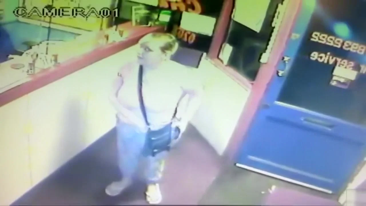 Blonde woman pisses right in front of the receptionist's desk