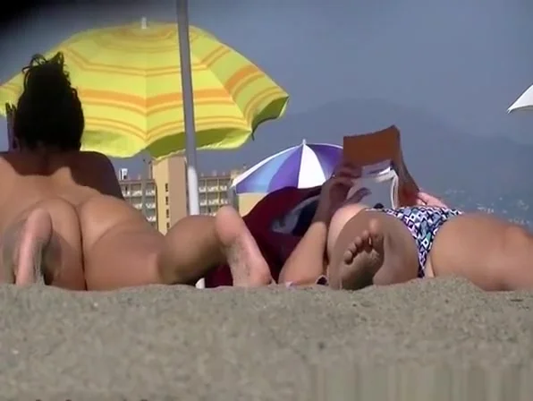Nude and topless women at beach