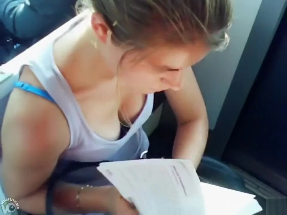 Great cleavage on a chick reading on the train