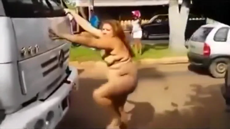 Naked curvy woman on the front of a big truck
