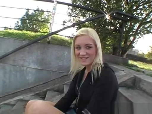 Sexy blonde shows off tits outdoor in public