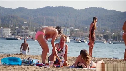 Tall brunette with big tits on topless beach