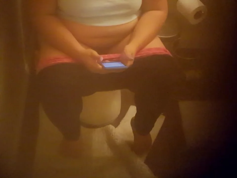 Filipina using toilet