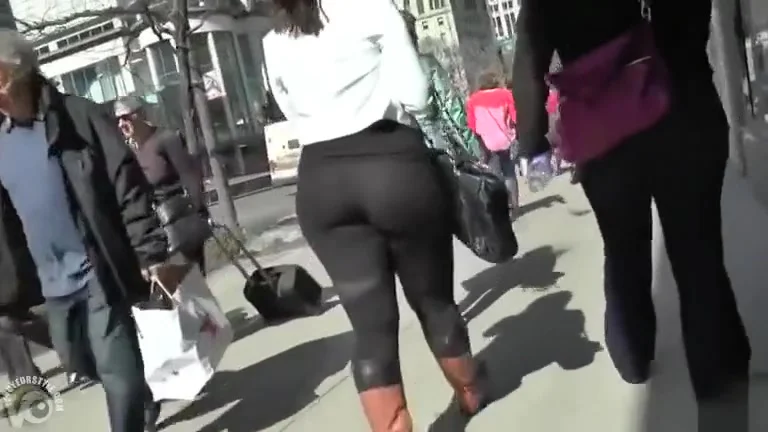 Big butt woman walks the city streets in spandex