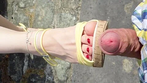 Jerking off on a pair of feet in high heels