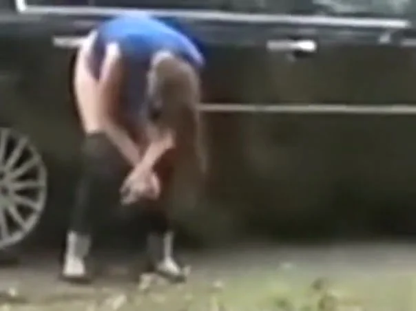Desperate babe pees on a public suburban street