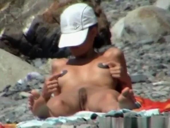 Skinny nudist woman sunbathing