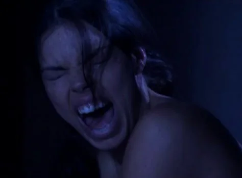 Luscious brunette has a guy roughly pounding her pussy in the dark
