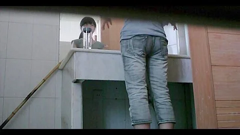 Dark haired asian chick pissing on
