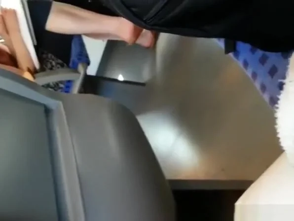 Guy playing with his cock in train