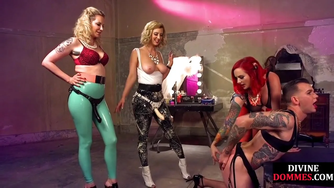 BDSM femdoms fuck crossdresser in group strapon action