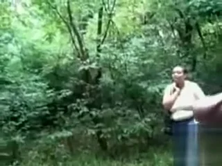 Chubby woman is mesmerized by his large cock in public
