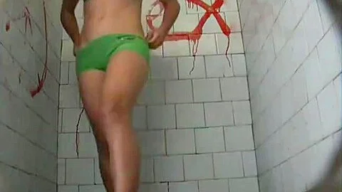 A brunette model goes to the pool bathroom to take a huge
