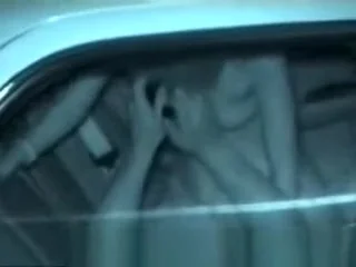 Couple having sex into a car
