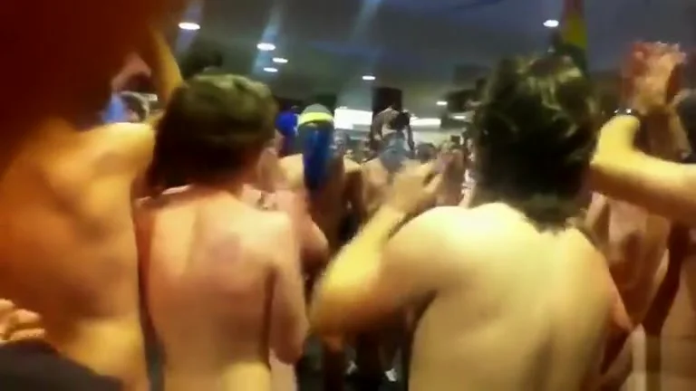 College nudists come through the main hall