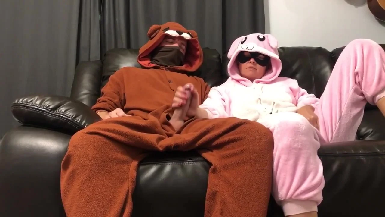 Bunny Pajama Girl Gives Handjob On Couch Watching Tv