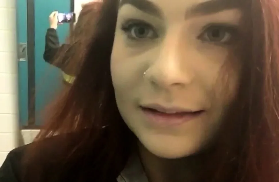 Big-Ass Schoolgirl's Strip Tease and Pussy Play in a Public