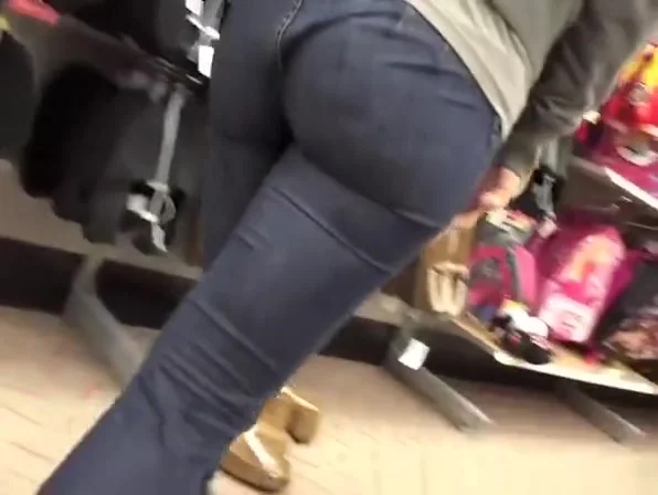 Woman in tight jeans pants bending over