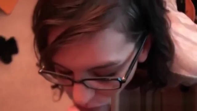 Girl in glasses sucking hard cock in POV style