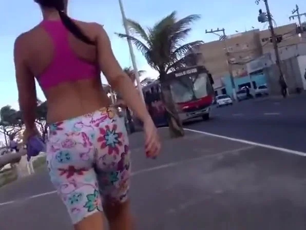 Brunette in spandex shorts walking