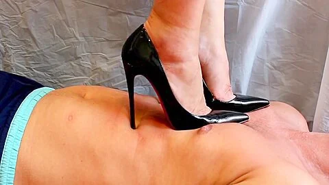 Hard Trampling Bdsm In High Heels. The Mistresss Patent Leather Shoes Dig Into The Slaves Stomach