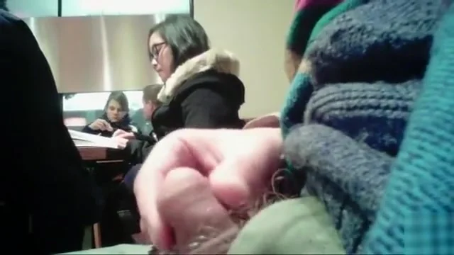 Brave guy strokes his penis in the public library
