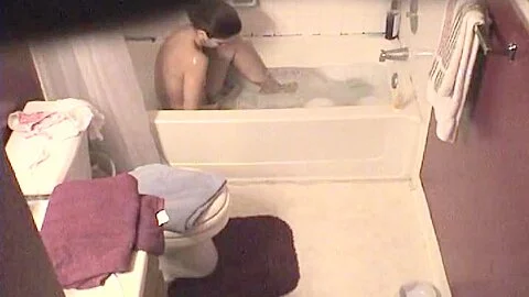 Voyeur video of a naked girl bathing