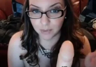 Nerdy Chick with glasses sucking dildo and masturbating