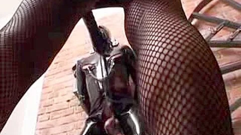 Brunette cruel mistress tortures a submissive male