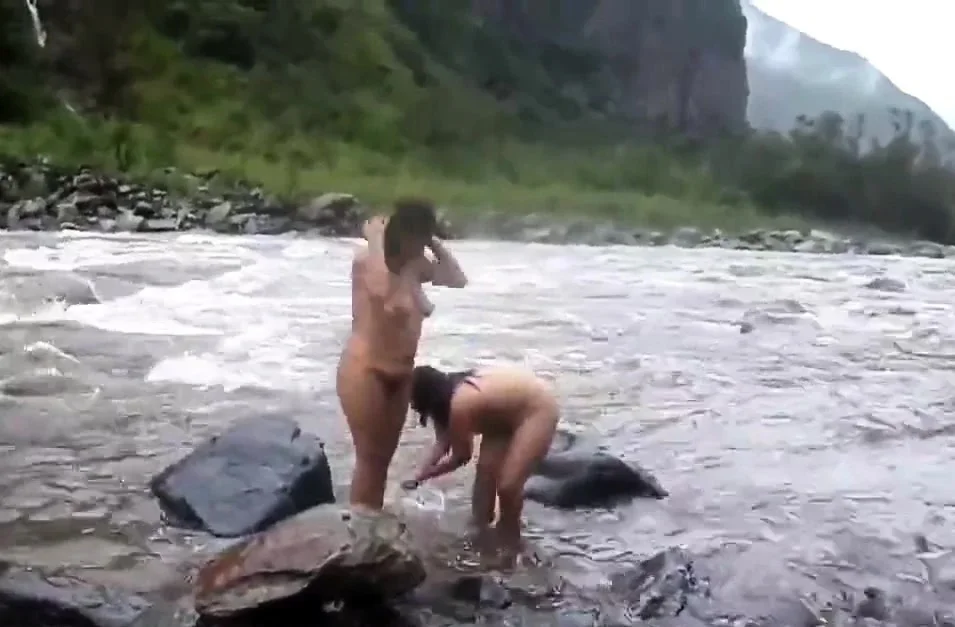 Two indian mature womens  bathing in river naked