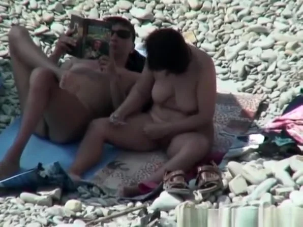 Busty nudist woman removing pubic hairs