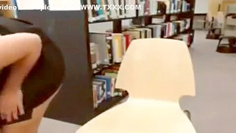 Ass fingering and dildoing in the library