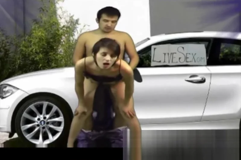 At the white car