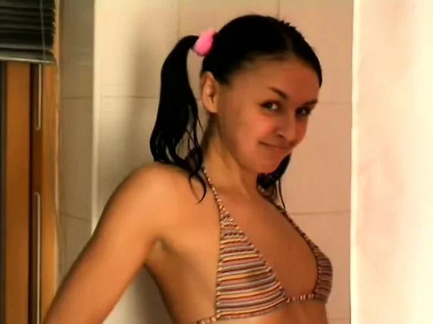Teen Lily does some seductive posing and teases in the bathtub