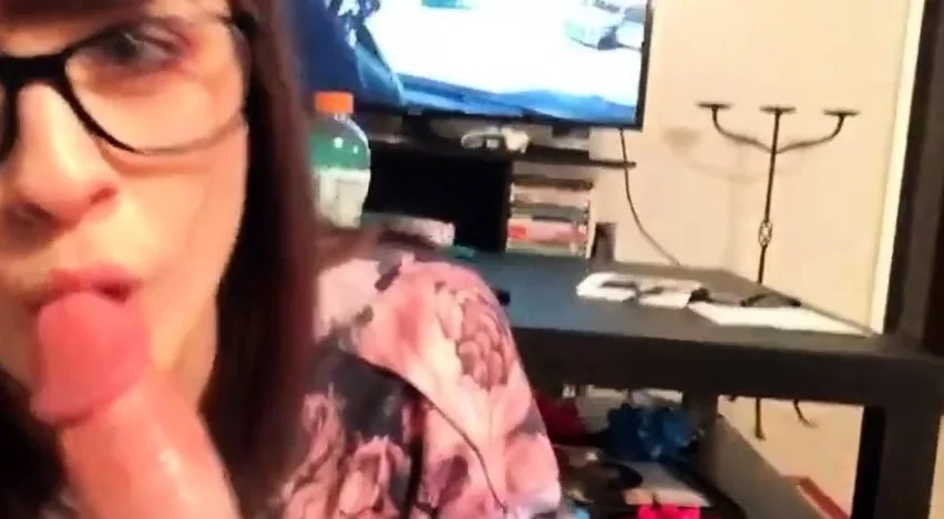 Brunette cute girl with glasses gives a nice blowjob